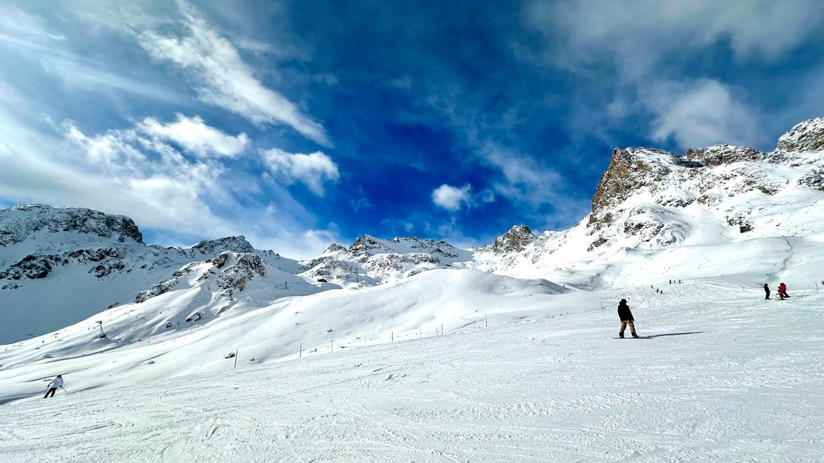 Corviglia ski area St. Moritz with modern ski lifts, groomed slopes, luxury ski resort, alpine scenery